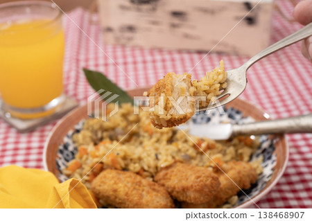 Savory Turmeric Rice with Crunchy Fish Savory Turmeric Rice with Crunchy Fish 138468907