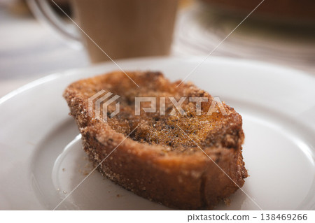 Spanish torrijas dessert on white plate close up Spanish torrijas dessert on white plate close up 138469266