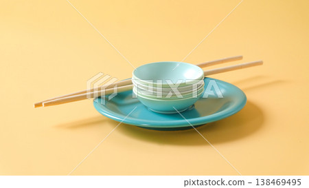 Plate and Chopsticks and small bowls on color background. Plate and Chopsticks and small bowls on color background. 138469495
