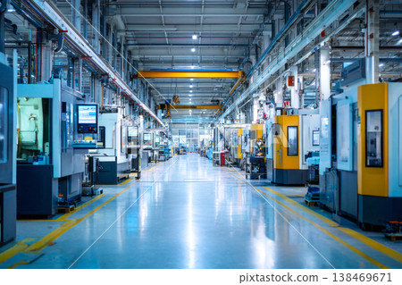 Bright, clean manufacturing hall with rows of interconnected automated machines operating production workflows Bright, clean manufacturing hall with rows of interconnected automated machines operating production workflows 138469671