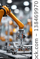 A robotic arm is working to assemble electronic components on a production line in an Industry 4.0 environment. Machines operate with advanced technology and automation 138469970