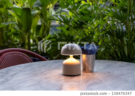 Table lamp with tissue paper on the table, in fine dining restaurant 138470347