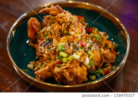 Stir Fried soft shell crab with salt and chili, served on plate 138470357
