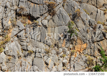Natural texture of a mountain cliff rock for background Natural texture of a mountain cliff rock for background 138471580