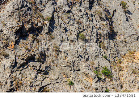 Natural texture of a mountain cliff rock for background Natural texture of a mountain cliff rock for background 138471581