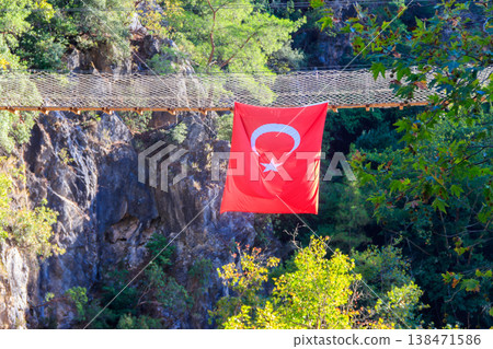 Turkish flag hanging from suspension wooden bridge in Goynuk canyon in Antalya province, Turkey 138471586
