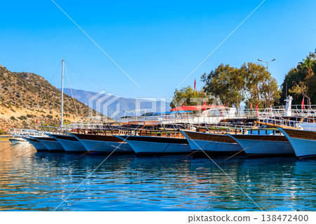 Port with tourist boats on the Mediterranean sea coast in Turkey 138472400