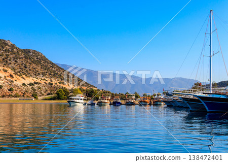 Port with tourist boats on the Mediterranean sea coast in Turkey 138472401