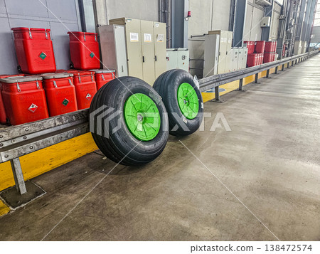 New aircraft wheels in a row at the airport maintenance hangar or warehouse. 138472574