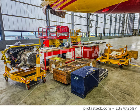 Aircraft engine maintenance in a hangar. Jet turbine repair and service for the aviation industry. 138472587