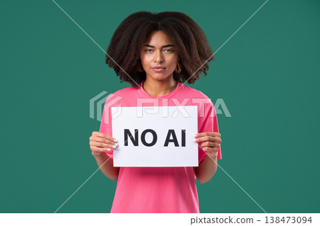 African Woman Holds Sign No Ai With Serious Face In Green Studio Visual Protest African Woman Holds Sign No Ai With Serious Face In Green Studio Visual Protest 138473094