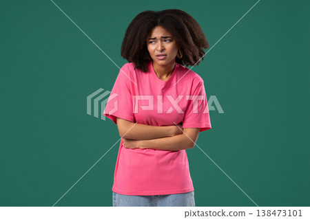 Young african woman squeezing Belly With Hands. Abdominal Pain, Suffering Stomach ache. Healthcare, problem with menstrual period cramps or bowel flatulence concept 138473101