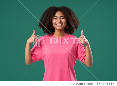 Happy woman gives thumbs up LIKE gesture with excitement and expressive approval Happy woman gives thumbs up LIKE gesture with excitement and expressive approval 138473117