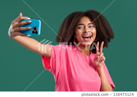 Happy African American Woman Talking To Camera As Video Call, Makes Selfie Happy African American Woman Talking To Camera As Video Call, Makes Selfie 138473124