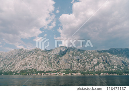 Imposing Craggy Heights Dominate Tranquil Seaside Landscape With Clouds Imposing Craggy Heights Dominate Tranquil Seaside Landscape With Clouds 138473187