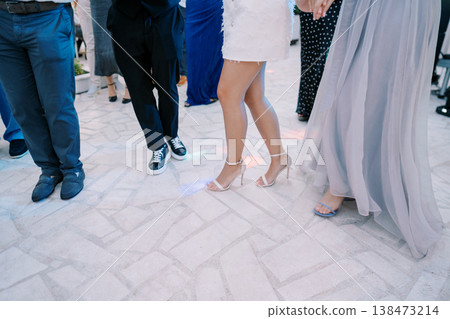 Dance Celebration Captured. Guests Dancing In Elegant Attire Dance Celebration Captured. Guests Dancing In Elegant Attire 138473214