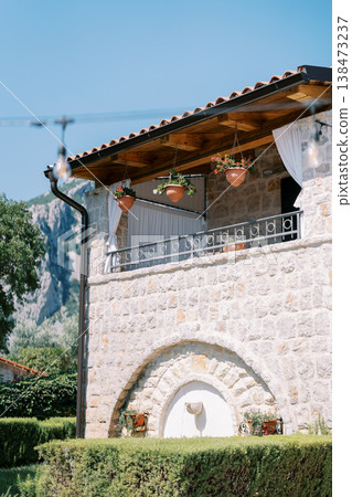 Morning Sunlight Illuminates Quaint Stone Structure With Scenic Mountain View 138473237