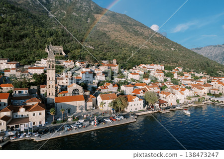 Picturesque Coastal Settlement With Vibrant Rainbow Overhead Picturesque Coastal Settlement With Vibrant Rainbow Overhead 138473247