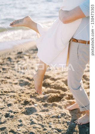 Romantic Beach Dance Captured During Sunset With Playful Spins And Footprints Romantic Beach Dance Captured During Sunset With Playful Spins And Footprints 138473303