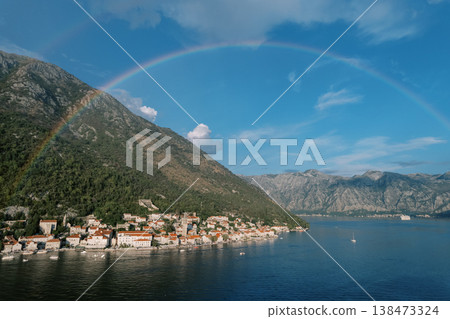Spectacular Multicolored Rainbow Extends Over Coastal Settlement And Marina 138473324