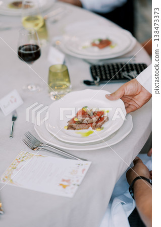 Refined Appetizer Display Featuring Wine And Modern Table Setup 138473373