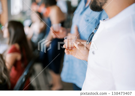 Unwound Attendees Indulge In Glowing Handmade Liquor Samples Under Sunshine Unwound Attendees Indulge In Glowing Handmade Liquor Samples Under Sunshine 138473407