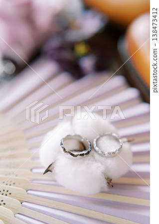 Elegant Setting Showcasing Delicate Cotton And Jewelry In Soft Lighting Elegant Setting Showcasing Delicate Cotton And Jewelry In Soft Lighting 138473412