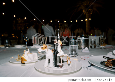 Intimate Micro Wedding Cake Topper Bride And Groom Poised For Cake Cutting 138473417