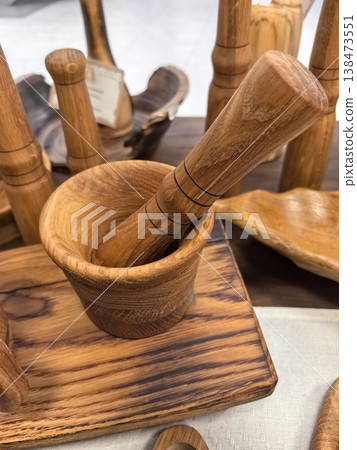 Crafting beauty with natural wood in a bustling artisan market 138473551