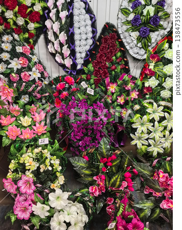 Colorful funeral wreaths symbolize love and remembrance during mourning moments 138473556