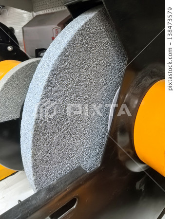 Grinding wheels preparing for precision work at a workshop Grinding wheels preparing for precision work at a workshop 138473579