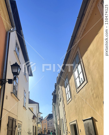Narrow Historic Street Old Town European Architecture Colorful Buildings Blue Sky Narrow Historic Street Old Town European Architecture Colorful Buildings Blue Sky 138474125
