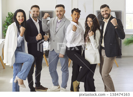 Six young multiethnic teammates celebrating joint success Six young multiethnic teammates celebrating joint success 138474163