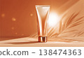 Luxury gold cosmetic tube mockup on sandy background with tropical palm leaf shadows, cinematic warm sunlight, premium sun care and summer beauty product. SPF cream package. This is AI-generated item 138474363