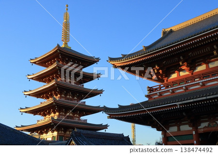 The five-story pagoda of Senso-ji Temple, shining in the setting sun, is a popular tourist attraction in Tokyo. The five-story pagoda of Senso-ji Temple, shining in the setting sun, is a popular tourist attraction in Tokyo. 138474492