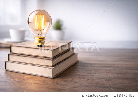 Warm Glow Above Stacked Books Suggesting Learning Warm Glow Above Stacked Books Suggesting Learning 138475493