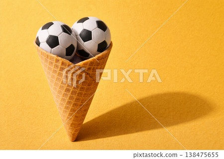 Playful Soccer Balls Inside a Waffle Cone Playful Soccer Balls Inside a Waffle Cone 138475655