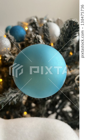 Blue Christmas Ornament on Tree Branch Blue Christmas Ornament on Tree Branch 138475736
