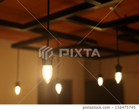 Warm Hanging Light Bulbs in Modern Room Warm Hanging Light Bulbs in Modern Room 138475745