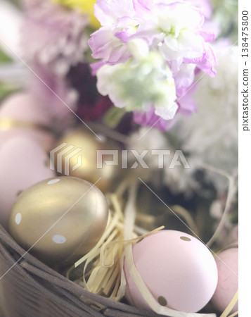 Pastel Easter Eggs in Floral Basket Setting Pastel Easter Eggs in Floral Basket Setting 138475800