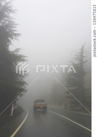 Lonely Truck Driving Through Thick Fog On Road 138475815