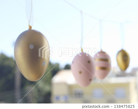 Pastel Easter Eggs Hanging in Sunlight Pastel Easter Eggs Hanging in Sunlight 138475825