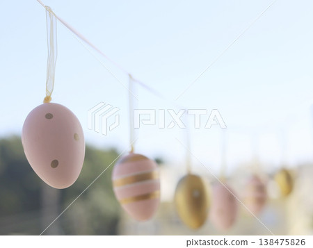 Pastel Easter Eggs Hanging Along Garden String Pastel Easter Eggs Hanging Along Garden String 138475826