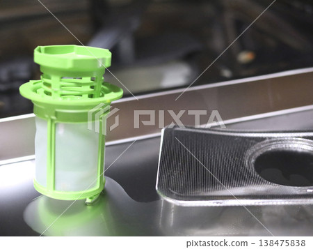 Green Dishwasher Filter Located Near Drain Area 138475838