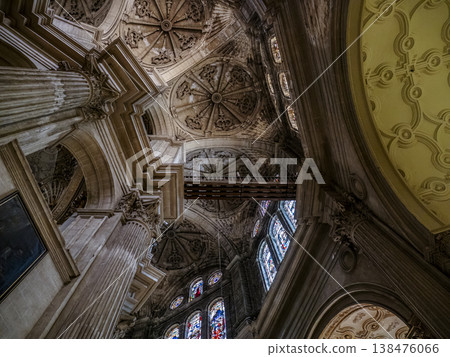Malaga Cathedral Interior With Ornate Stained Glass, Columns and Elaborate Sculpted Ceiling in Dramatic Perspective Malaga Cathedral Interior With Ornate Stained Glass, Columns and Elaborate Sculpted Ceiling in Dramatic Perspective 138476066