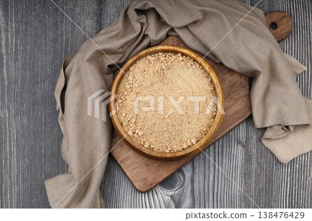 Organic Oleaster Seed Powder in a Rustic Wooden Bowl on a wooden Background for Healthy Living Organic Oleaster Seed Powder in a Rustic Wooden Bowl on a wooden Background for Healthy Living 138476429