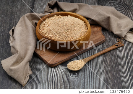 Organic Oleaster Seed Powder in a Rustic Wooden Bowl on a wooden Background for Healthy Living Organic Oleaster Seed Powder in a Rustic Wooden Bowl on a wooden Background for Healthy Living 138476430