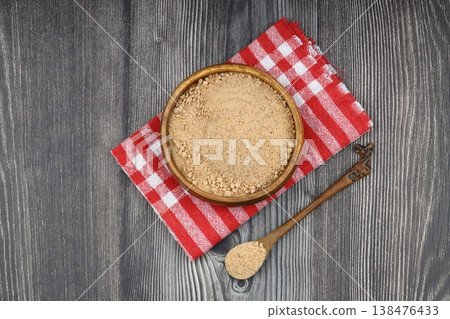 Organic Oleaster Seed Powder in a Rustic Wooden Bowl on a wooden Background for Healthy Living Organic Oleaster Seed Powder in a Rustic Wooden Bowl on a wooden Background for Healthy Living 138476433