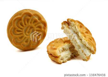 Delicious Crispy Sandwich Biscuit with Smooth Vanilla Cream Filling Isolated on White Background Delicious Crispy Sandwich Biscuit with Smooth Vanilla Cream Filling Isolated on White Background 138476438