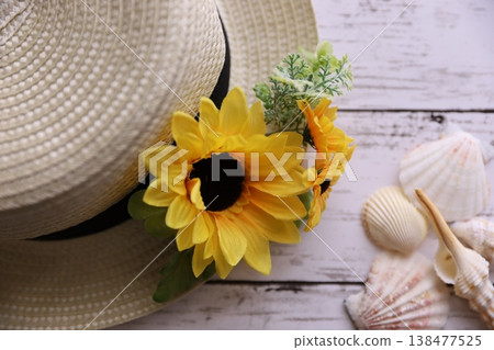 Summer flowers and straw hats Summer flowers and straw hats 138477525